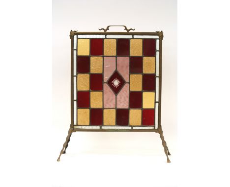 A brass firescreen with leaded and stained glass panel, 70cm x 47cm