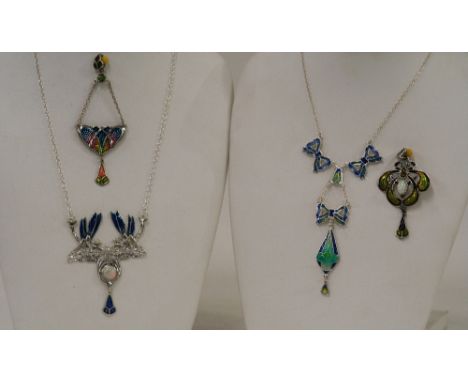 Four Art Nouveau style Sterling silver and enamel pendants, two hung to fine link chains 