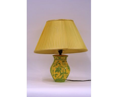 A Crown Devon table lamp, decorated with stylised leaping stag, 44cm including shade