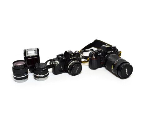 Nikon EM Camera With Series E Lens f1.8 50mm together with Series E lenses f2.8 100mm and f2.8 28mm; and Nikon F501 with Nikk