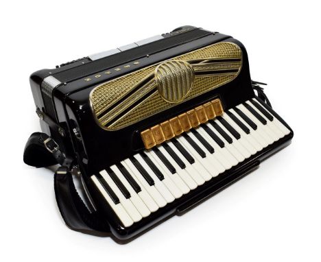 Hohner Musette IV Accordion 120 bass buttons and 41 treble keys, 9 treble voice paddles and 3 bass paddles; voices include Cl