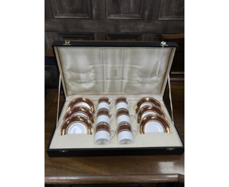 ROYAL DOULTON COFFEE SERVICE, Buckingham pattern, comprising six cups and six saucers, in a fitted case, the case 47cm wide