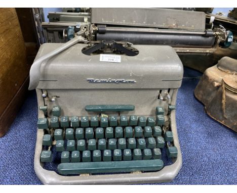 VINTAGE REMINGTON TYPEWRITER, along with another typewriter (2)