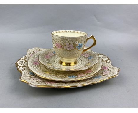 TUSCAN TEA SERVICE, decorated with flowers in pink, blue and yellow and with gilt detailing, comprising eight cups, eight sau