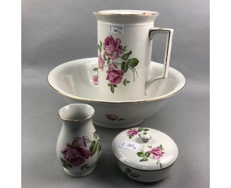 HAND PAINTED CERAMIC EWER AND BASIN, with floral decoration, the ewer 28cm high, along with a matching vase and lidded dish (