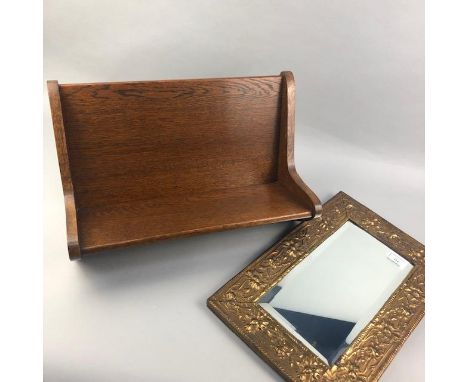 GILT FRAMED WALL MIRROR, with moulded flower head decoration, 41cm x 27.5cm, along with a stained wood book trough (2)