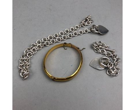 20TH CENTURY WHITE METAL CHAIN AND BRACELET, each stamped 925, with heart appendages, along with a rolled gold bangle