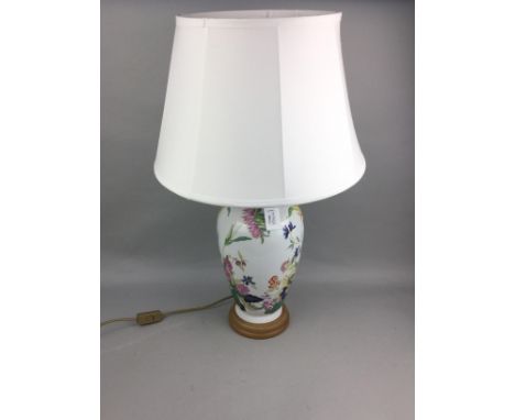 20TH CENTURY CERAMIC VASE, with floral decoration, converted to a table lamp on a wooden stand, with white shade, along with 