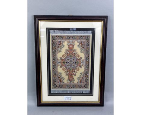 EMBROIDERED PANEL FORMED AS A MIDDLE EASTERN RUG, 31cm long, mounted, framed and under glass, along with two prints and a fra