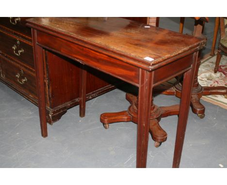 A LATE GEORGIAN MAHOGANY FOLD OVER CARD TABLE