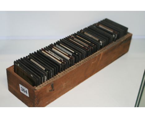 A BOX OF VINTAGE LANTERN SLIDES