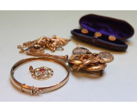 A SMALL ART NOUVEAU RUBY AND SEED PEARL SET CIRCULAR PENDANT AND A 9CT.GOLD STIFF BRACELET.ETC.   £80-100