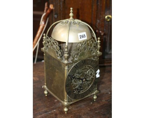 A LATE VICTORIAN BRASS CASED LANTERN STYLE CLOCK WITH TWIN TRAIN WINTERHALDER AND HOFFMIER BELL STRIKE MOVEMENT, THE DIAL SIG