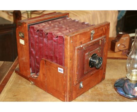 AN UNUSUAL FULL PLATE MAHOGANY AND BRASS STUDIO CAMERA BY MEAGHER AND FITTED WITH ROSS LENS
