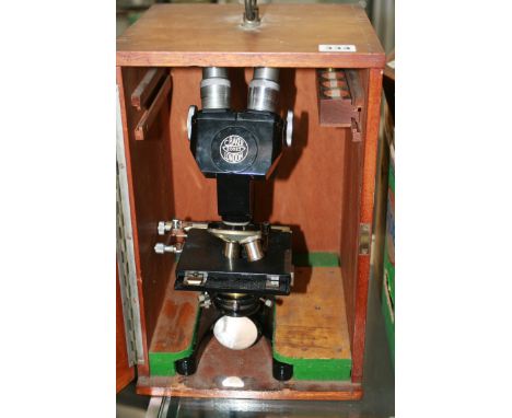 A VINTAGE BINOCULAR MICROSOPE BY BAKER OF LONDON