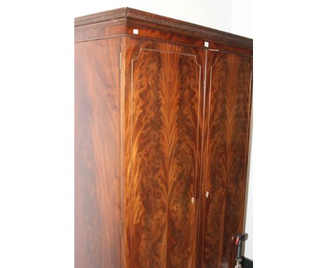 AN EDWARDIAN REGENCY STYLE TWO DOOR WARDROBE