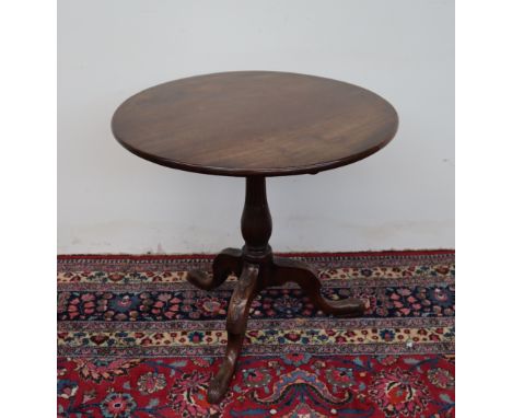 A George III mahogany occasional table, the circular top on a snap action on a stop fluted baluster column and husk chain car