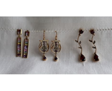 A pair of 9ct yellow gold garnet and diamond drop earrings, 4cm long together with a pair of 9ct yellow gold amethyst and see