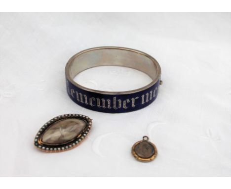 A blue enamel and white metal hinged bangle, "Remember Me", stamped "AP", together with a 19th century Momento Mori brooch wi