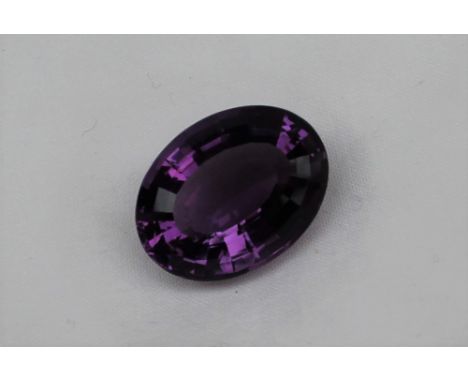 An unmounted amethyst, of oval faceted form, measuring approximately 21mm x 16mm, approximately 3.8 grams