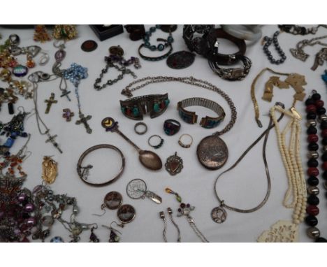 A silver locket together with a silver hinged bangle, other silver jewellery and assorted costume jewellery including beaded 