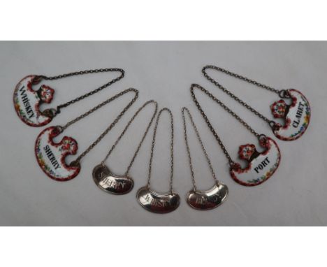 A set of three George VI silver wine labels, of oval shape for Whisky, Sherry and Brandy, Sheffield, 1938, together with four