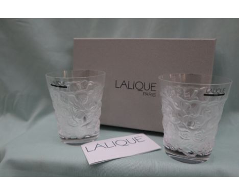 A pair of Lalique glass beakers, embossed with flowers, inscribed "Lalique (R) France, with original labels and box  CONDITIO