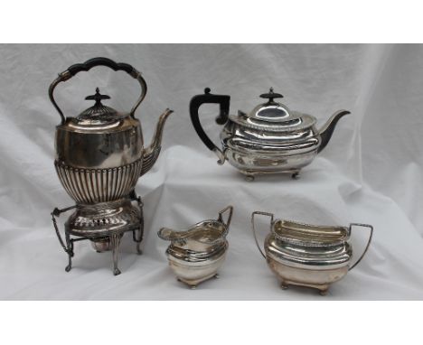 A George V silver three piece teaset, comprising a teapot, twin handled sugar basin and a cream jug, with a gadrooned edge an