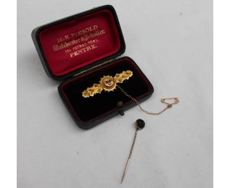 A Victorian 15ct yellow gold bar brooch, set with a sapphire, ruby and diamond, approximately 3.2 grams, together with a stic