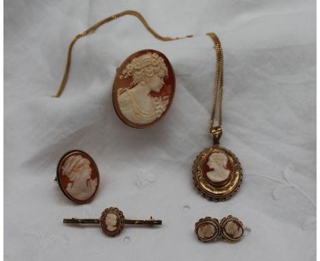 A 9ct yellow gold and shell cameo, depicting a head and shoulders portrait of a lady in profile together with a shell cameo r