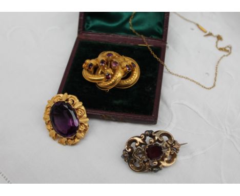 A Victorian brooch, set with a central faceted amethyst in a yellow metal mount, together with an amethyst and yellow metal b