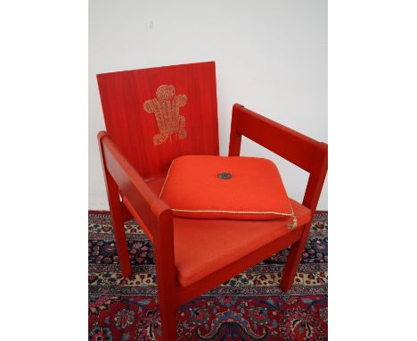 The Earl of Snowden and Carl Toms, a red painted beech and laminate elbow chair produced for the Investiture of the Prince of