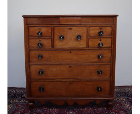 A Victorian mahogany Scotch chest, with a rectangular moulded top above a central frieze drawer, hat drawer, four short drawe