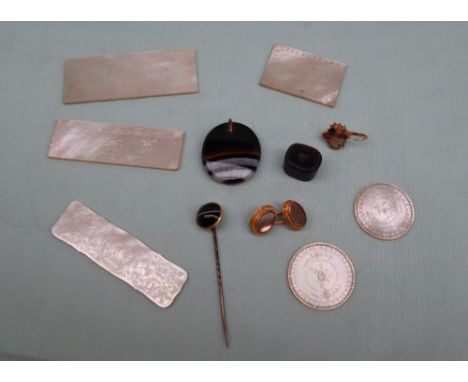 A desk seal, engraved with a central heart and "To Be Exchanged Not Sold", together with a banded hardstone stick pin, a band