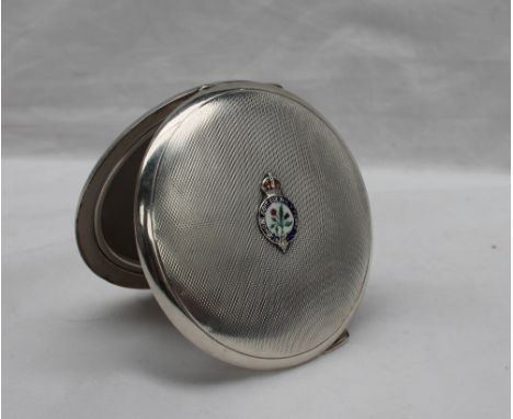 A George VI Silver compact, the circular engine turned top with an enamel decorated shield with a crown above a sash "Honi So