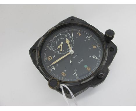 A Smiths V308 8 Day RAF Aircraft Cockpit Clock, the signed black dial with Arabic numerals, centre seconds and Time of Trip s