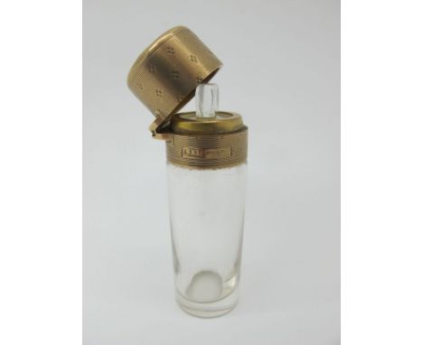 A 9ct Gold Mounted Glass Scent Bottle, EHP, London 1912, with engine turned hinged lid (dented) and internal glass stopper, 7