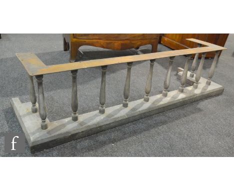 A mid 20th Century baluster rail fender on plinth base, length 136cm, A/F.