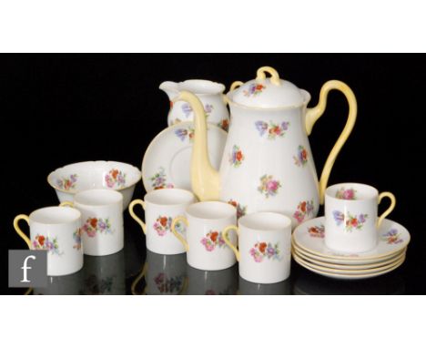 A Shelley coffee set decorated in the Tulip and Rose pattern comprising coffee pot, milk jug, sugar bowl and six cans and sau