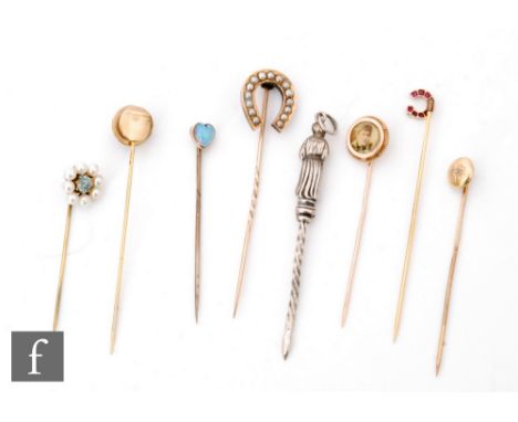 Eight late 19th Century and later stick pins, various styles, to include one set with a heart shaped opal (S/D), another with