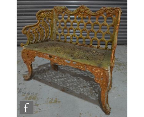 A Coalbrookdale style cast iron two seater bench with pierced back and seat on cabriole legs, width 112cm. 