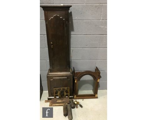 An incomplete 19th Century oak longcase clock trunk with associated hood, together with three clock weights, a brass finial a