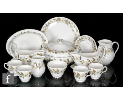 A Wedgwood Beaconsfield pattern 12-place setting dinner and tea service with some additional pieces, comprising 18 dinner pla