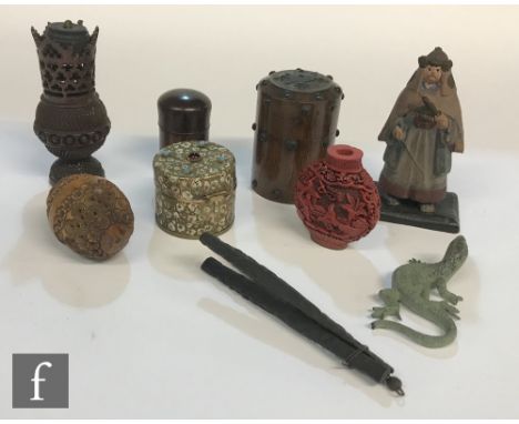 A 19th Century carved coquilla nut, a string box, a small bronze lizard, a Chinese snuff bottle, etc. 