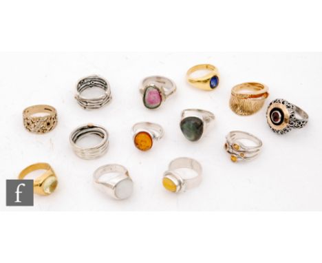 Twelve silver and silver gilt dress rings to include plain and stone set examples, with a 9ct dress ring. 