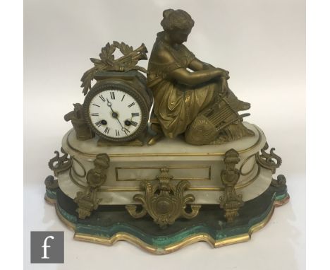 A 19th Century French gilt alabaster mantle clock mounted with a seated Romanesque figure playing a lyre on oval base and scr