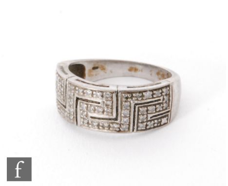 An 18ct white gold diamond ring, pave set stones to a Greek key patterned head, weight 8g, ring size R. 