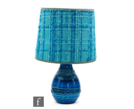 A Bitossi Rimini blue table lamp with impressed decoration complete with a blue woven lampshade, unmarked, base height 17cm. 