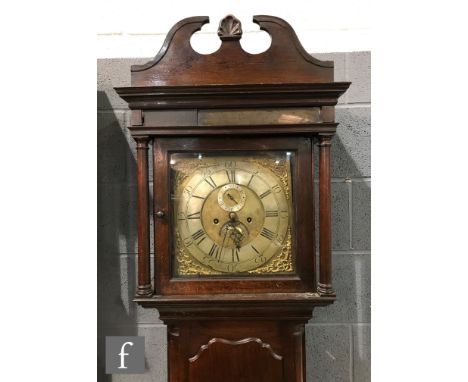 A late 18th Century mahogany longcase clock with an 8-day movement striking on a bell, with swan neck pediment above the 12 i