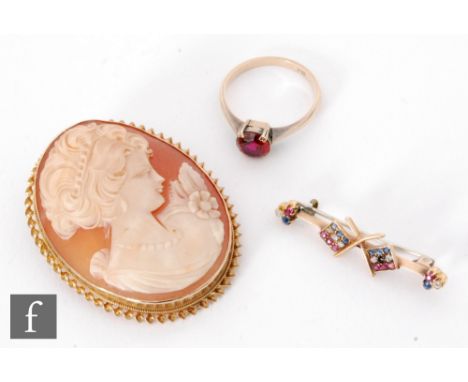 A 9ct hallmarked oval cameo brooch profile of a young girl, together with a ruby, sapphire and diamond set double flag bar br